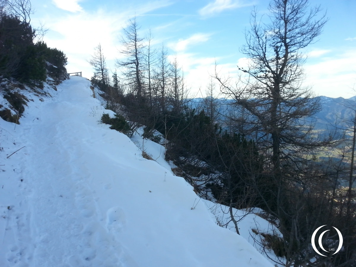 Small roads up, full of snow on top of ice. A nasty drop down