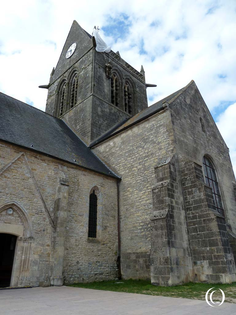 The church at Sainte-Mère-Église with paratrooper John Steele hanging from the tower - Normandy, France