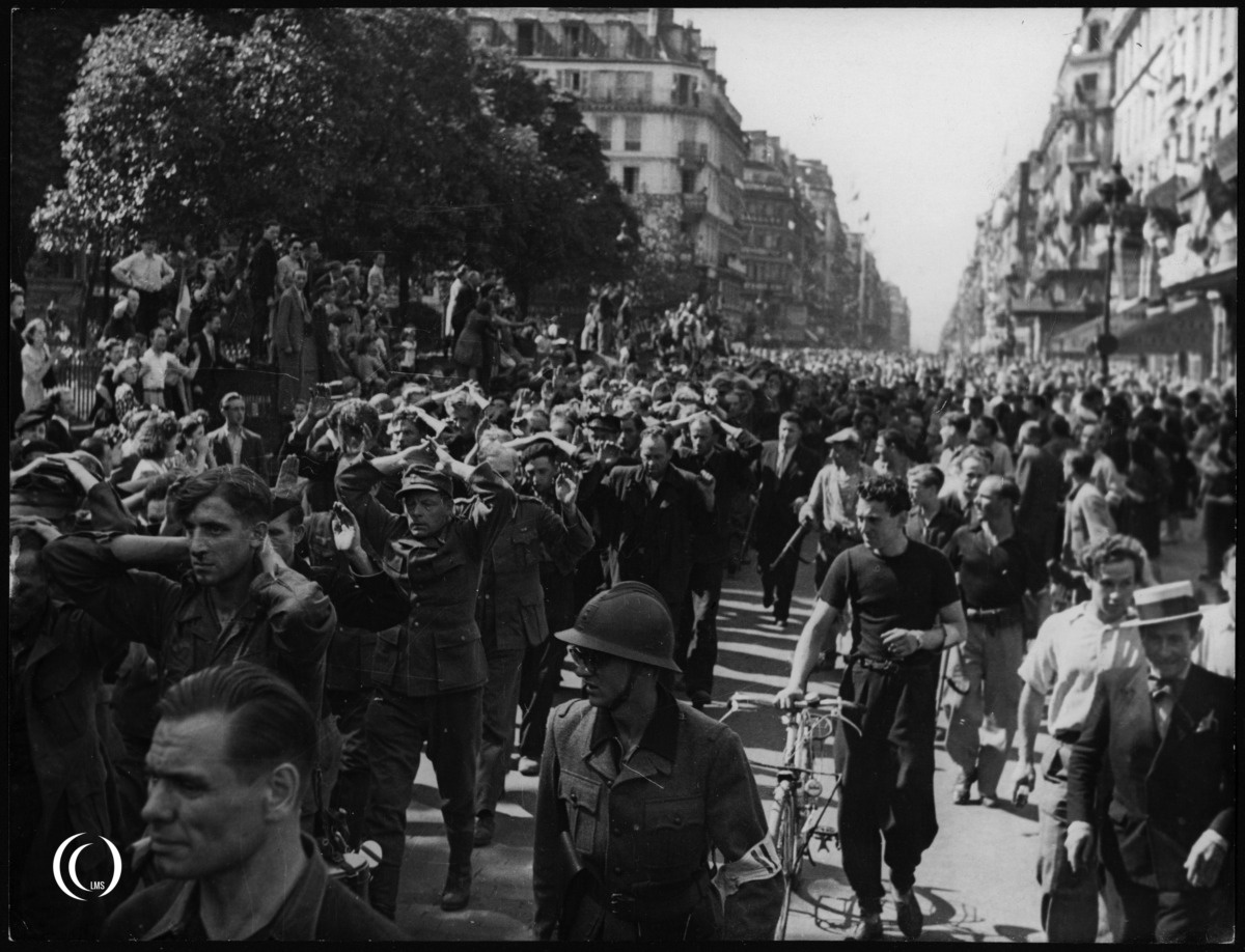 Column of German POWs being escorted by members of the FFI in Paris