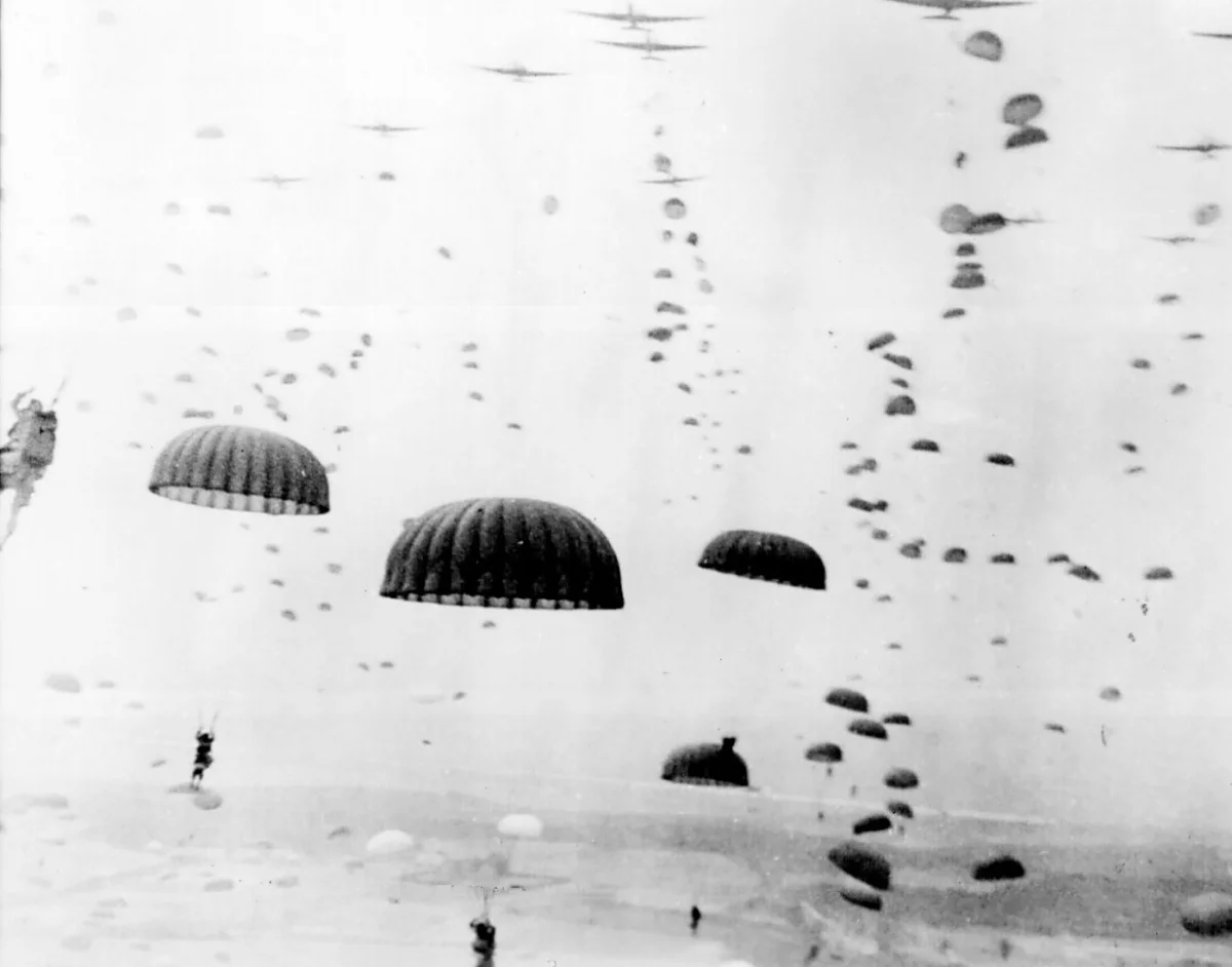 Paratroopers fall from the sky during Market Garden