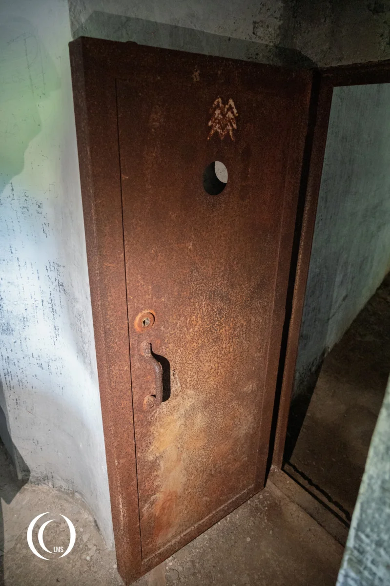 Metal door inside bunker (Opera VI) of the Pian dei Morti barrier in Alto Adige, Italy