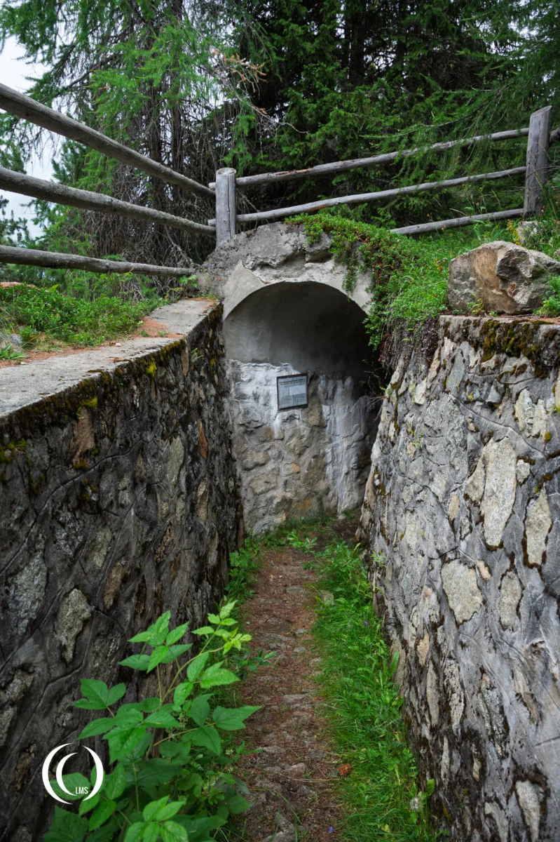 Open trench leading into bunker XIV at the Pian dei Morti barrier in Alto Adige, Italy